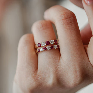 Two natural burmese ruby and natural diamond bands on a hand.
