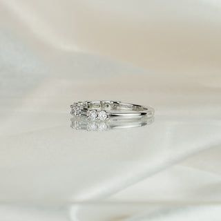 White gold band with round brilliants alternating baguette lab grown diamonds in shared prongs, 2.5mm stone row.