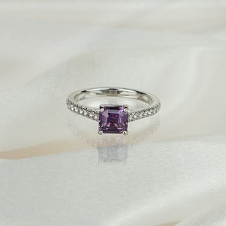 White gold cathedral engagement ring with a 1.50 carat Asscher cut purple Sapphire and pavé set shank.