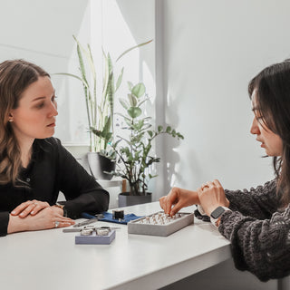 Custom engagement ring consultation at the Vancouver studio, discussing design options in person.