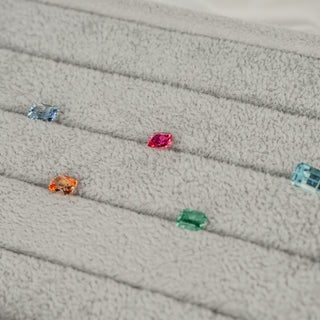 Loose colored Sapphires on a tray at the Vancouver studio.