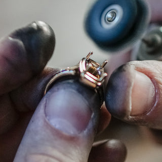 Goldsmith working on a custom piece at the Vancouver studio bench.