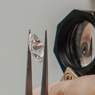 Diamond viewed through a jeweler's loupe at the Atelier Fine Co. bench.