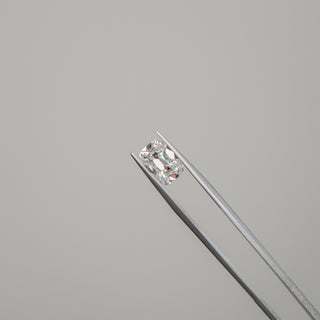 Loose lab grown Diamond held in tweezers at the Atelier Fine Co. bench.