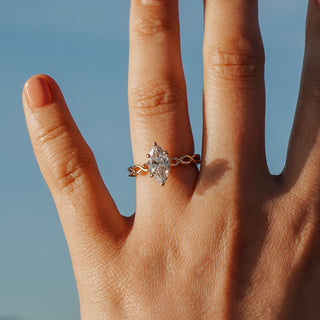 Marquise engagement ring worn on the hand by the ocean in Vancouver.