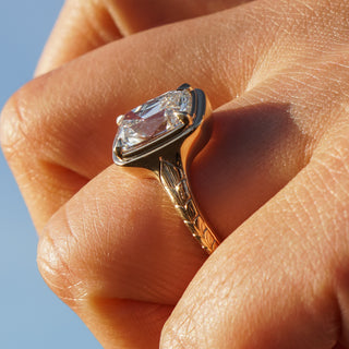 Hand-engraved ring shank held at the Atelier Fine Co. bench in Vancouver.