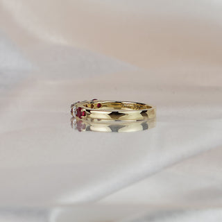 Side view of a Burmese Ruby and Diamond wedding band, 2.9mm stone row tapering to a 2.3mm gold band.