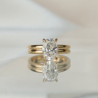 Yellow gold solitaire with a 2.58 carat cushion cut lab diamond, two stacked bands forming the 4.45mm double shank.