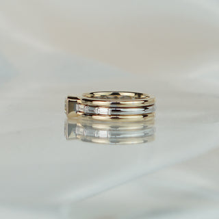 Side view of a yellow Diamond bezel engagement ring, triple shank layers visible beneath the bar-set baguettes.