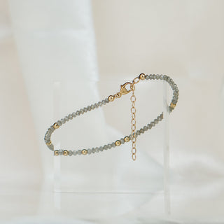 Natural grey Diamond bracelet laid flat showing the yellow gold clasp and 1.5 inch extension chain.