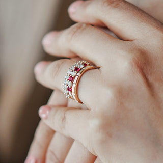 Yellow gold half eternity band with shared claw set lab diamonds, stone row visible along the front of the band.