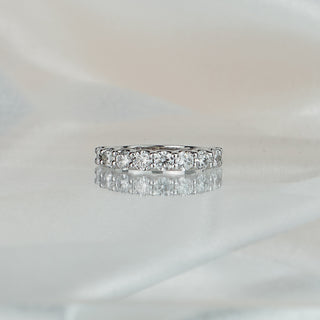 White gold half eternity band with scallop shared claw set lab grown diamonds, 3.5mm stone row along the front.