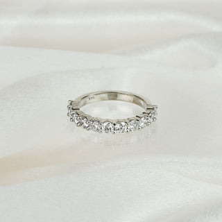 Lab grown diamond half eternity band in white gold on satin fabric, eleven round brilliants in shared claws.