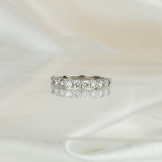 White gold half eternity band with shared claw set lab grown diamonds, 3.0mm stone row across the front.