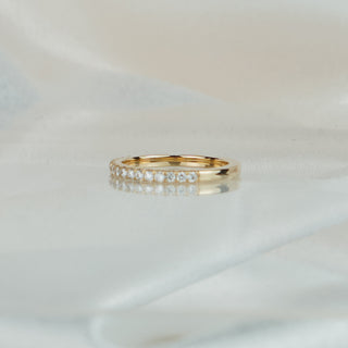 Yellow gold half eternity band with micro pavé set lab grown diamonds, 1.5mm stones in an even row.
