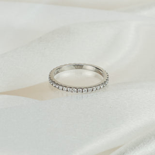 White gold micro pavé band with lab grown diamonds covering ninety percent of the circumference.