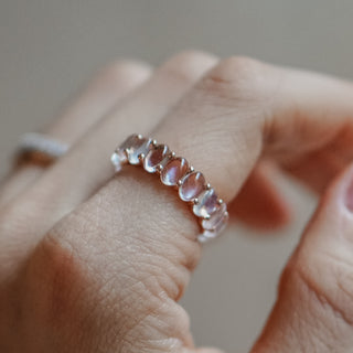 Moonstone ring worn on the finger.