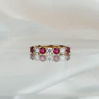 Yellow gold band with four natural Burmese Rubies alternating three Diamonds, wide stone row across the front.