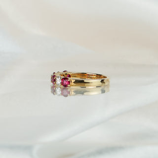 Side view of a Burmese Ruby and Diamond wedding band, 3.5mm stones tapering to a 2.7mm gold band.

