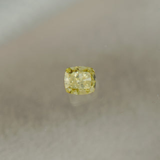 Yellow diamond on a gray background