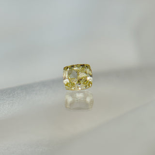 Yellow diamond on a gray background
