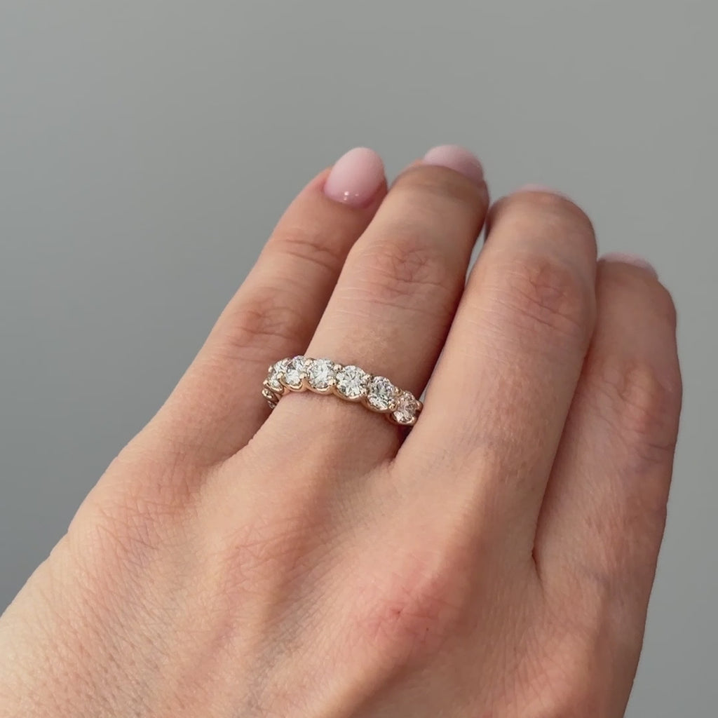Video of a yellow gold lab grown diamond half eternity band worn on the hand, 2.30 ctw stone row in motion.