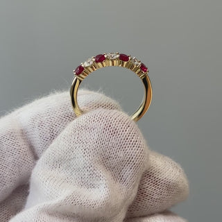Video of a natural Burmese Ruby and Diamond band on a gloved hand, alternating stones turning through the light.