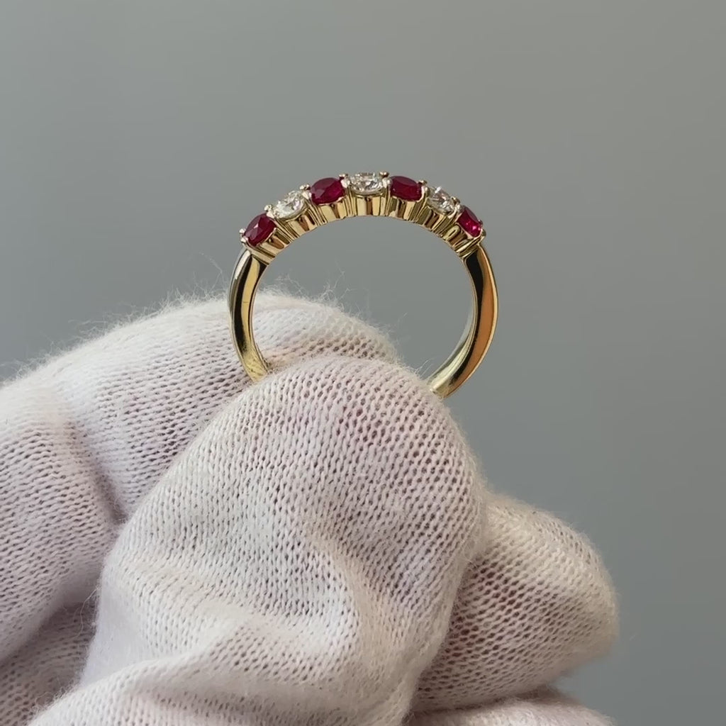 Video of a natural Burmese Ruby and Diamond band on a gloved hand, alternating stones turning through the light.