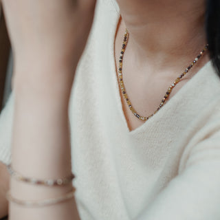 Raw faceted diamond bead necklace and bracelet with yellow gold accents.