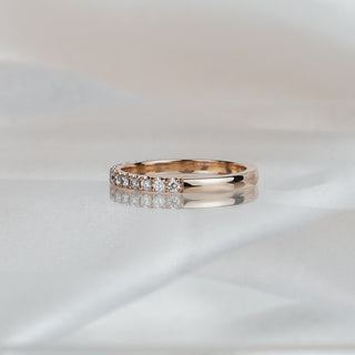 Side view of a natural Diamond micro pavé band in rose gold, stones meeting a plain polished back.