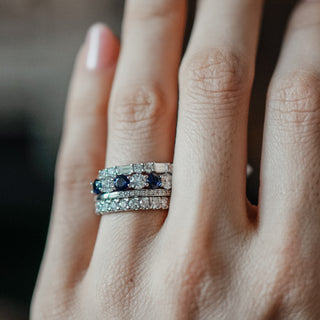 Ceylon blue Sapphire and Diamond band worn stacked with a second band, deep blue stones at 3.8mm width.
