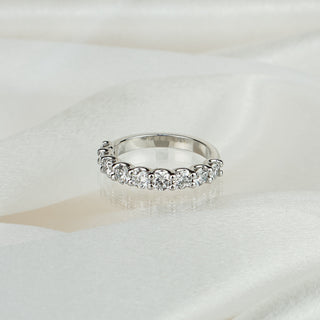Lab grown diamond half eternity wedding band in white gold on satin fabric, nine round brilliants in scallop shared claws.