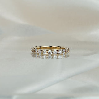 Half eternity band with scallop set lab grown diamonds, stone row across the front in yellow gold.